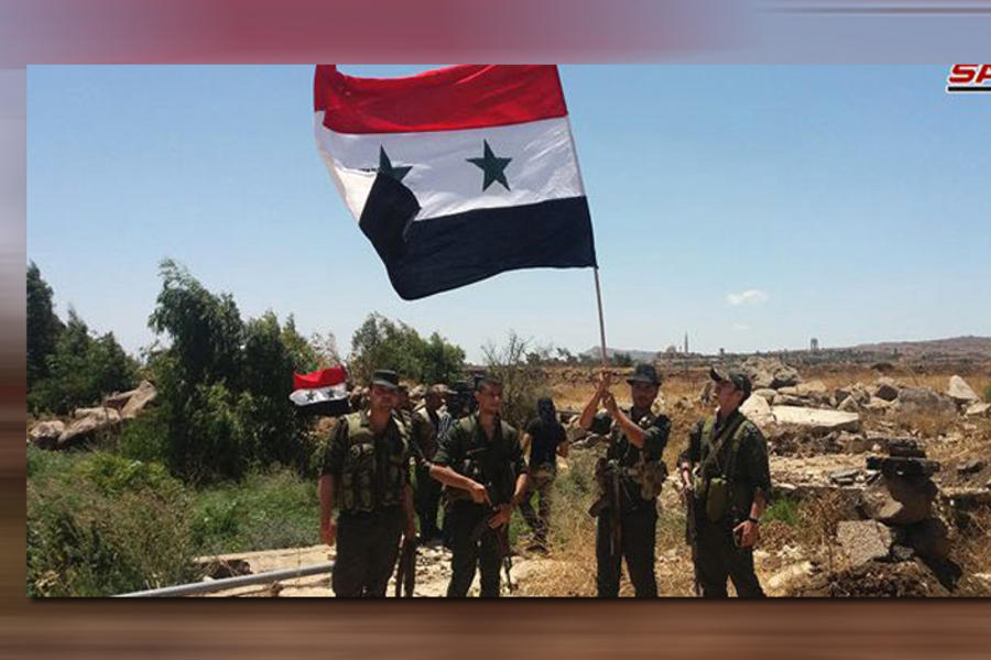 Unidades del Ejercito Árabe Sirio alzan el pabellón nacional en la capital provincial de Quneitra, al sudoeste del país | Julio 26, 2018 (Foto SANA)