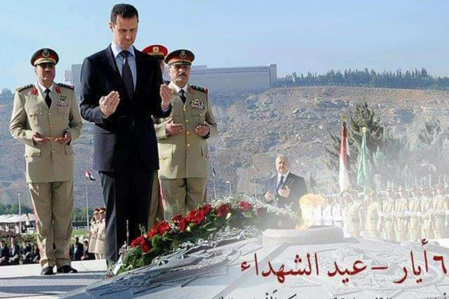 El presidente sirio, Bashar Al Asad, orando por los mártires en acto oficial del centenario (Damasco, Abril 6, 2016)