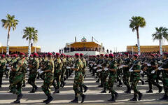 Las Fuerzas de Defensa Popular (PMF) en un desfile militar conmemorando su octavo aniversario | Diyala, Julio 23, 2022 (Oficina de Prensa del Primer Ministro Iraquí/vía Reuters)