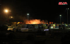 Extinción del fuego tras ataque aéreo israelí al Puerto de Lataquia (7/12/2021)  |  [Foto: SANA]