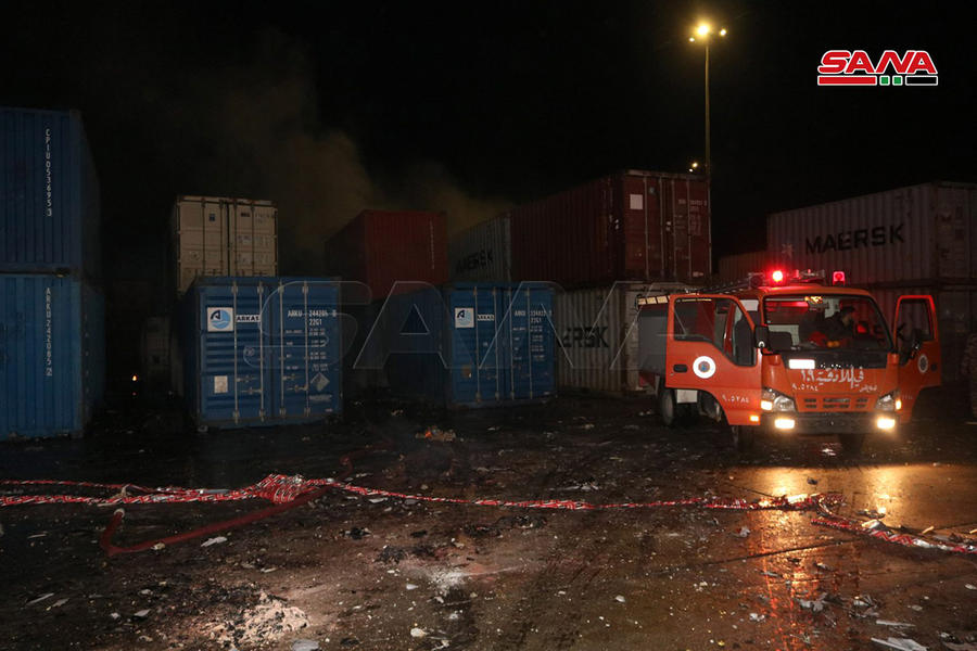 Extinción del fuego tras ataque aéreo israelí al Puerto de Lataquia (7/12/2021)  |  [Foto: SANA]